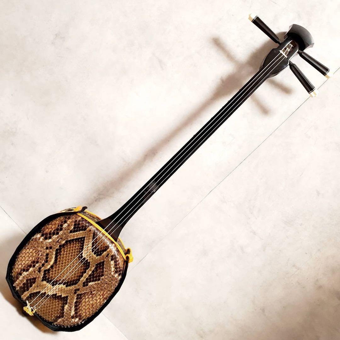 沖縄三線 本蛇皮張り 高級クロコ調ハードケース付き 付属品充実 演奏確認済