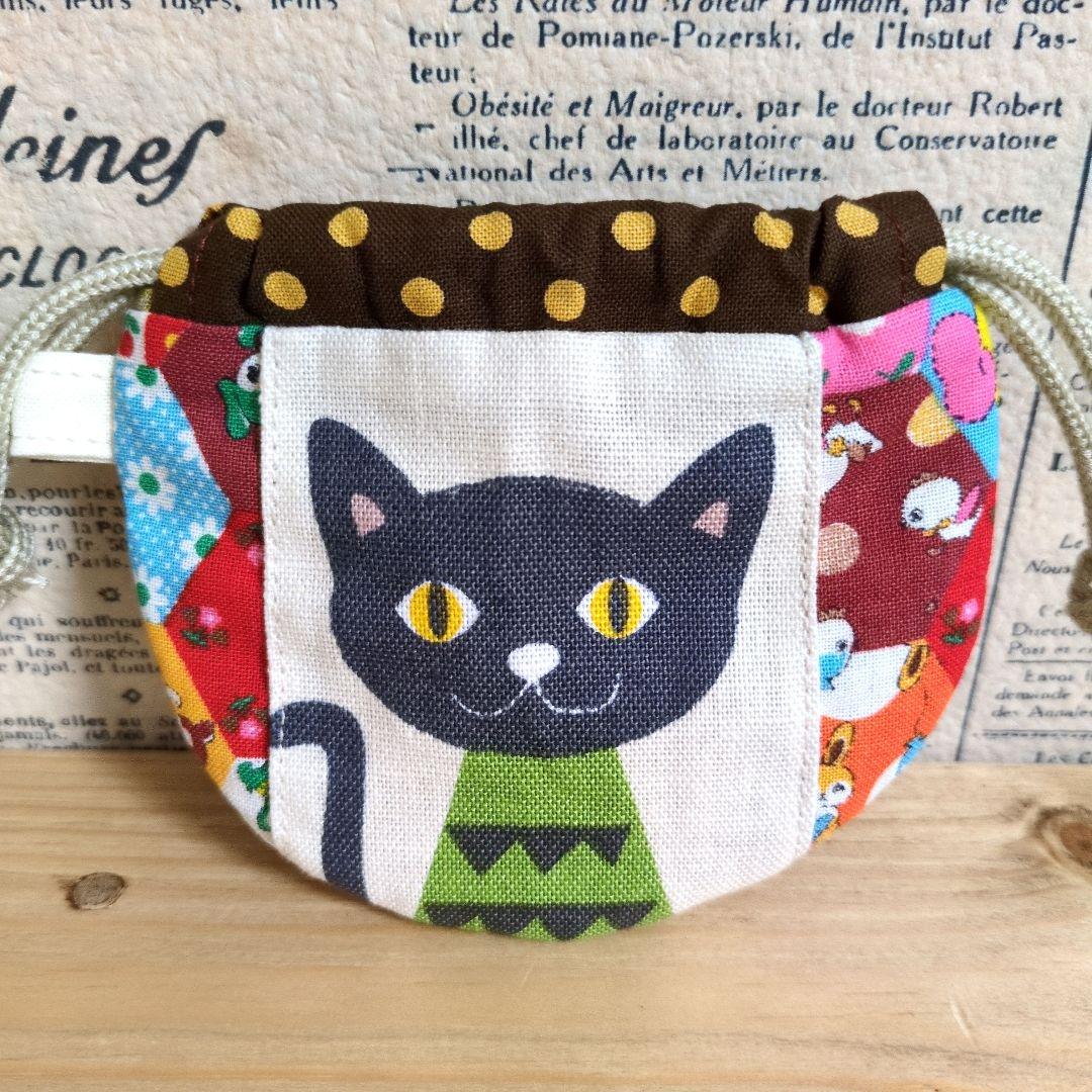 ハンドメイド　まるいミニ巾着 (ネコ　ハニーチューン　花柄)