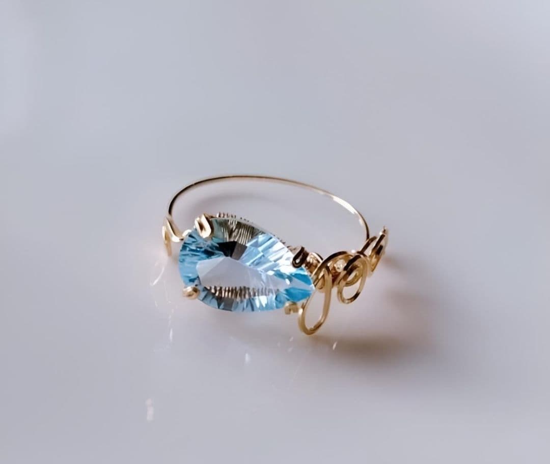 Kgf14 宝石ルース スイスブルートパーズ コンケーブ アラベスク リング