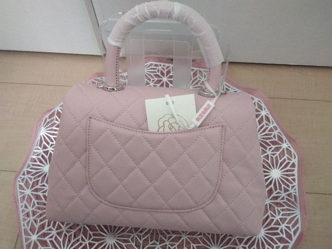 CHANEL ピンク ココハンドルキャビアスキン(本革)バッグ。チェーン付