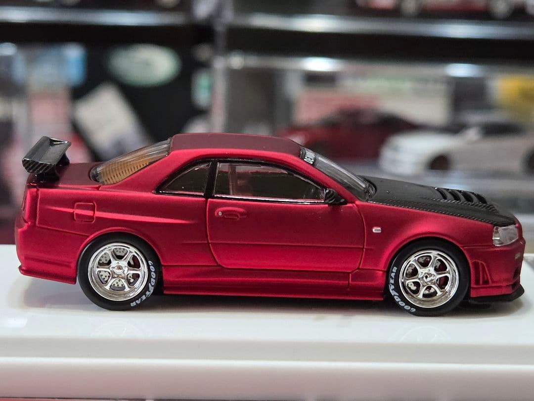 限定700台1/64車魔王AUTOEXPO2025日産スカイラインGT-R34赤