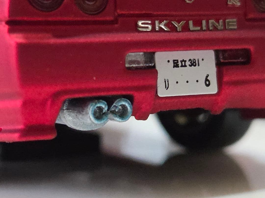 限定700台1/64車魔王AUTOEXPO2025日産スカイラインGT-R34赤