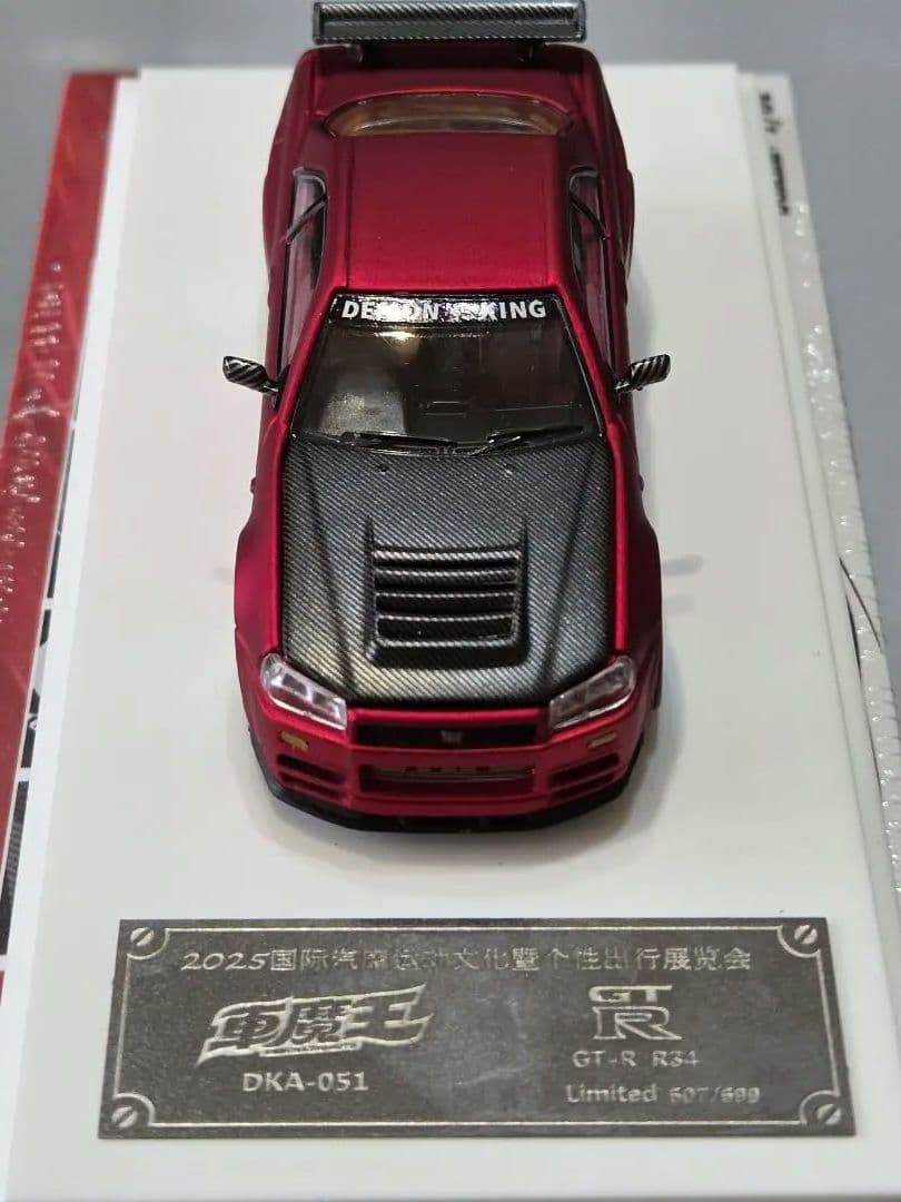 限定700台1/64車魔王AUTOEXPO2025日産スカイラインGT-R34赤