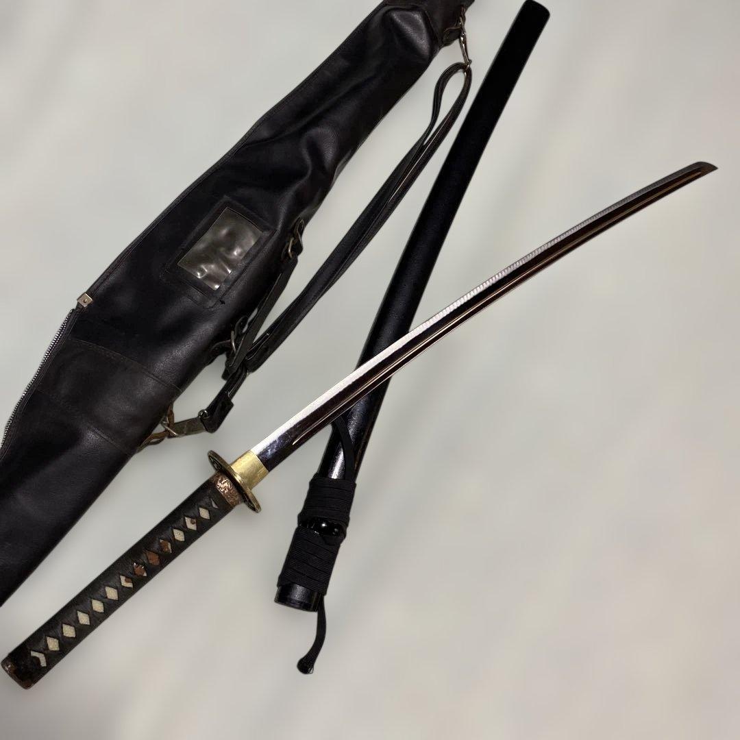 居合刀(刀ケース付) 黒柄 龍彫透し丸鍔 黒梨地鞘