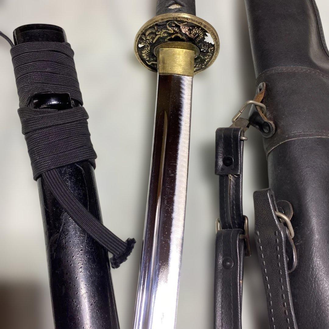 居合刀(刀ケース付) 黒柄 龍彫透し丸鍔 黒梨地鞘