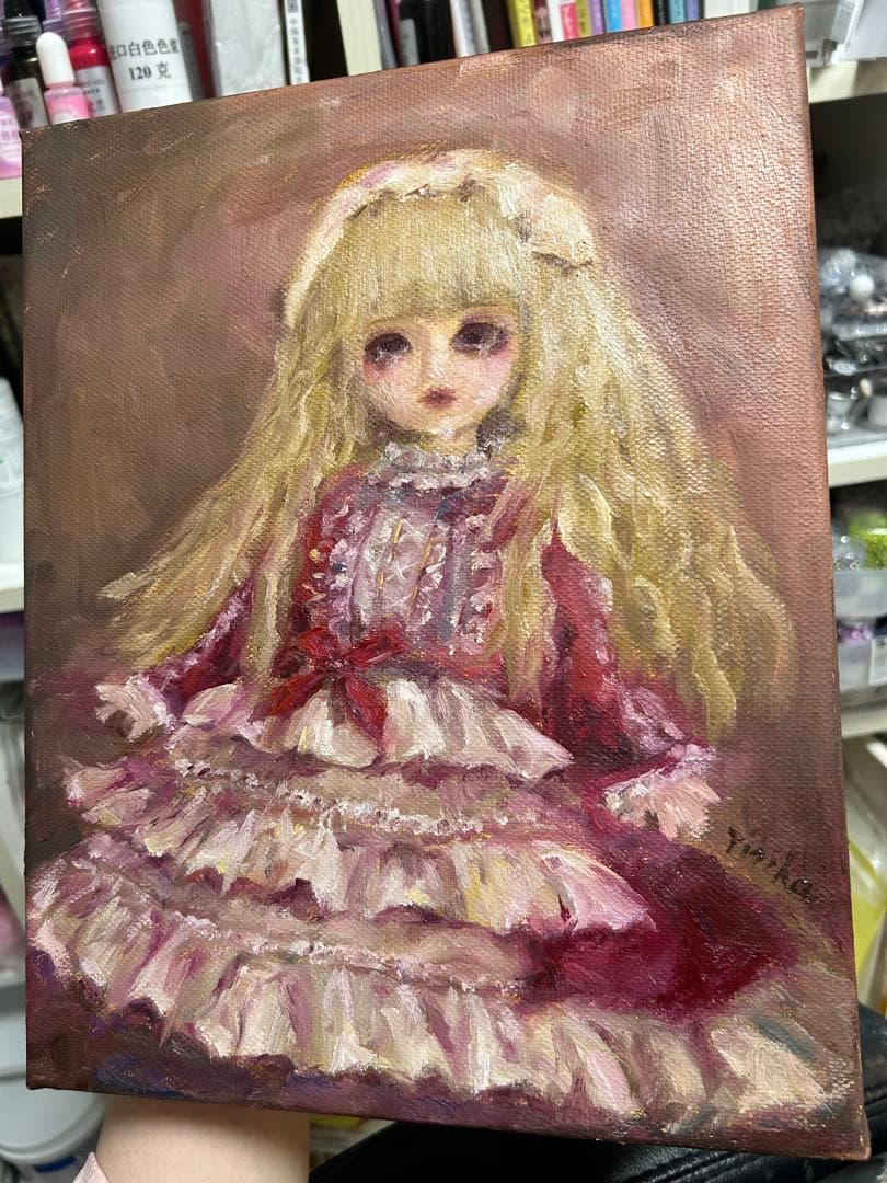 泣いてるの人形の油彩画