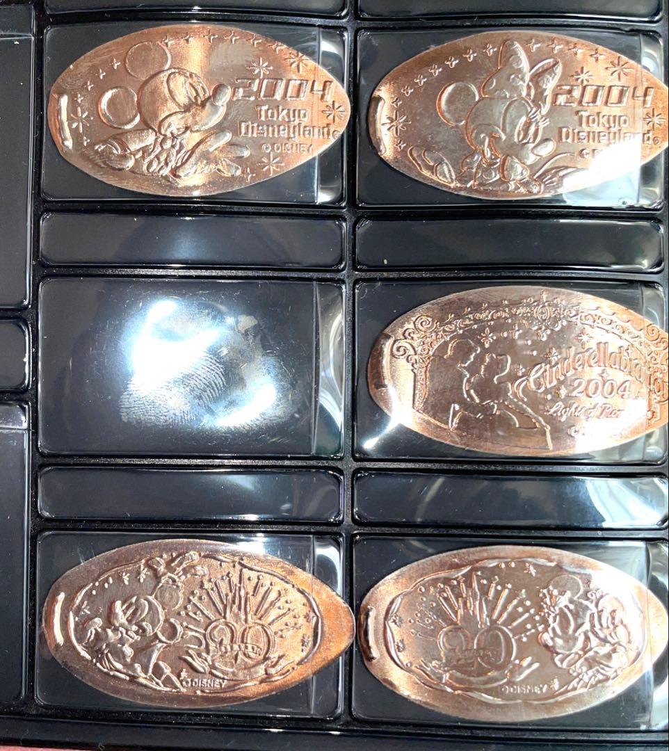 極美品/2004年限定ディズニー スーベニアメダル 23枚 公式ブック付20周年