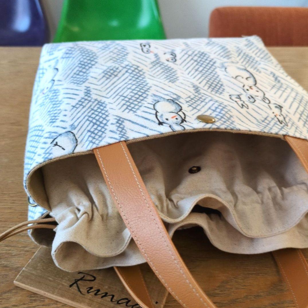 あおりポケットの巾着バッグ＊ミナペルホネン