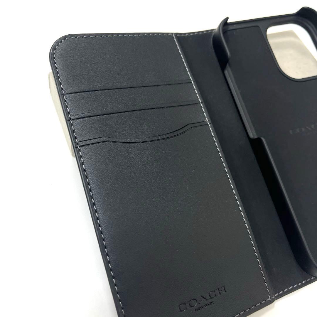 【美品】コーチ シグネチャー柄 iPhone16用手帳型カバー ブラック