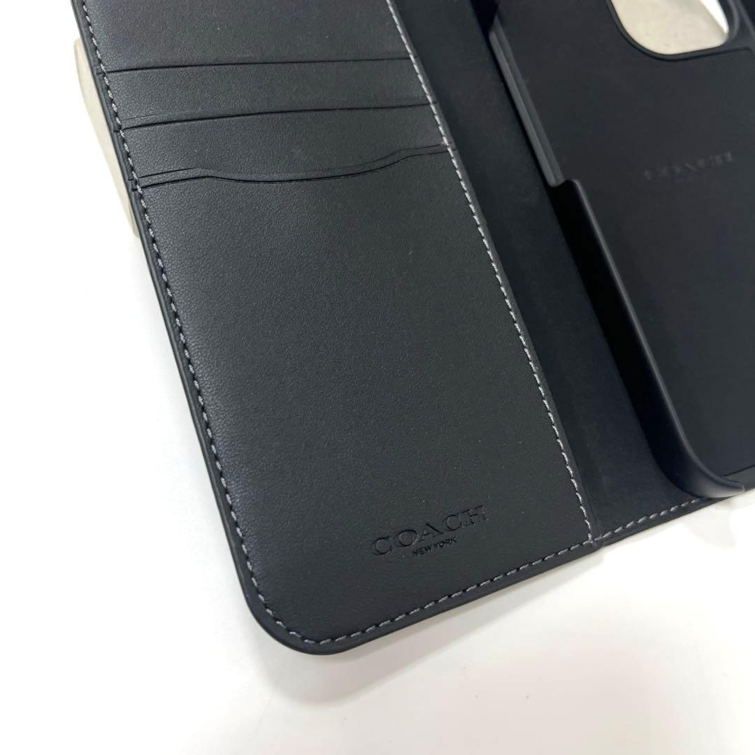 【美品】コーチ シグネチャー柄 iPhone16用手帳型カバー ブラック