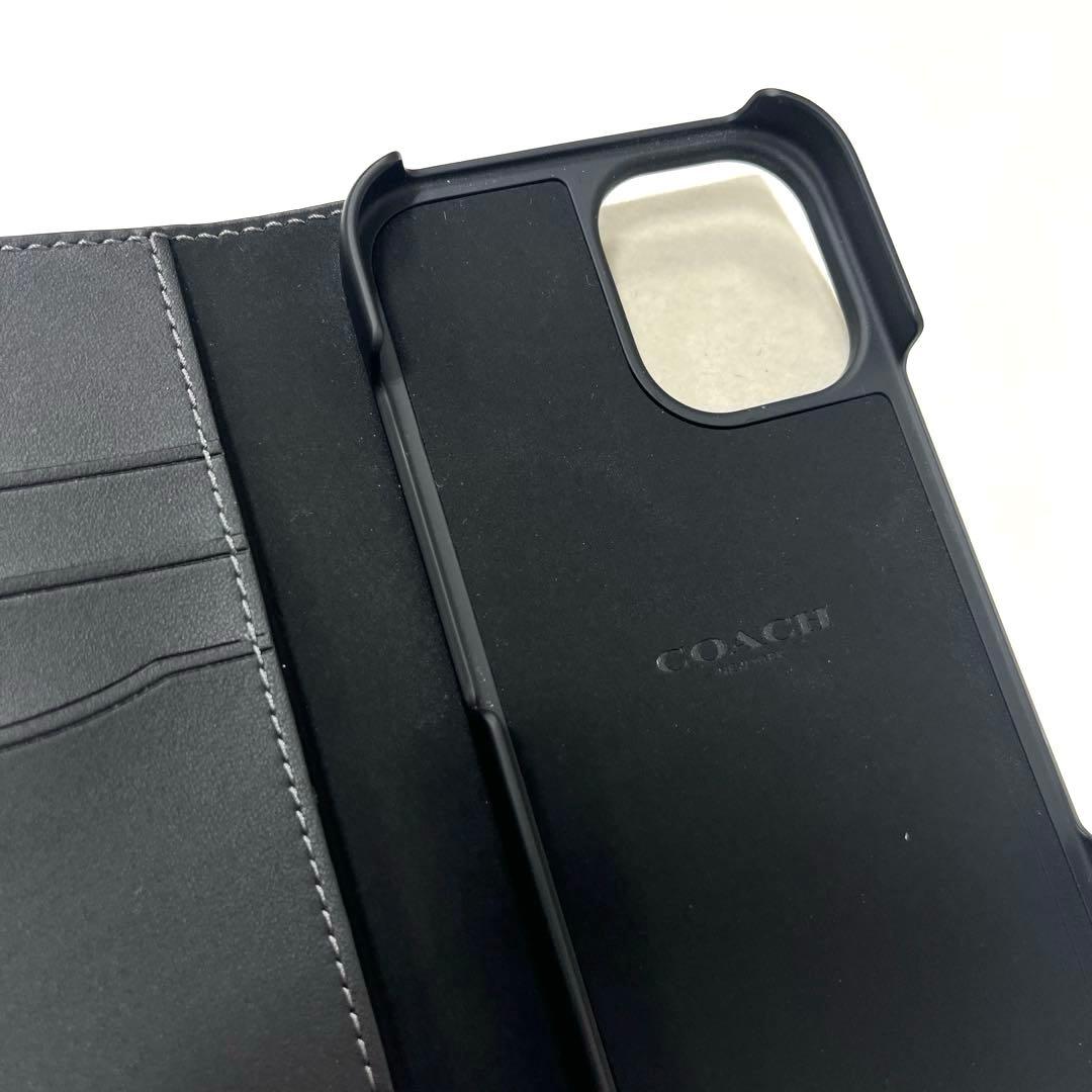 【美品】コーチ シグネチャー柄 iPhone16用手帳型カバー ブラック