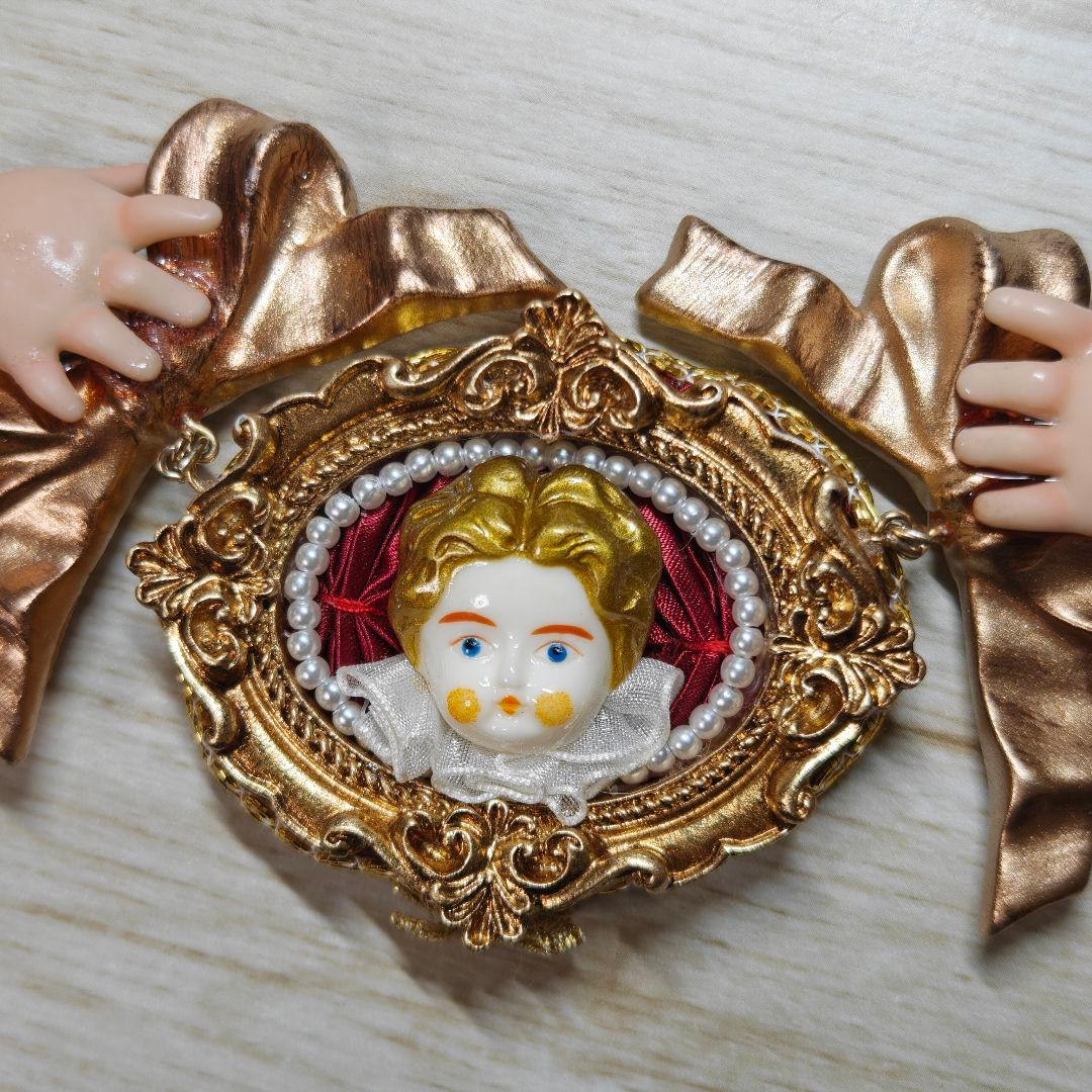 Unlogical Poemユニークな人形モチーフ ネックレス