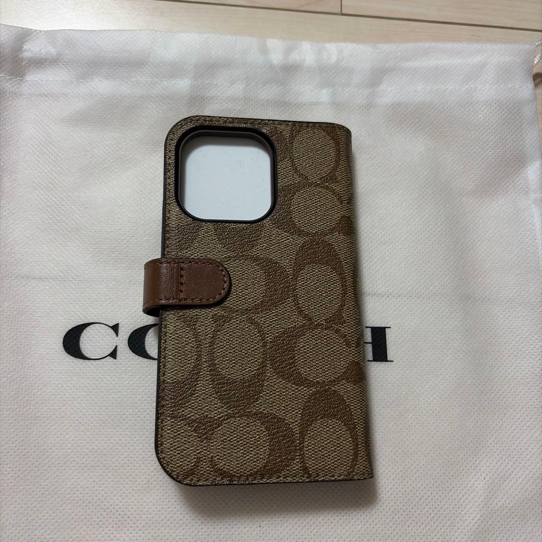 コーチiPhone15 PRO ケース シグネチャー 手帳型 スマホケース 収納