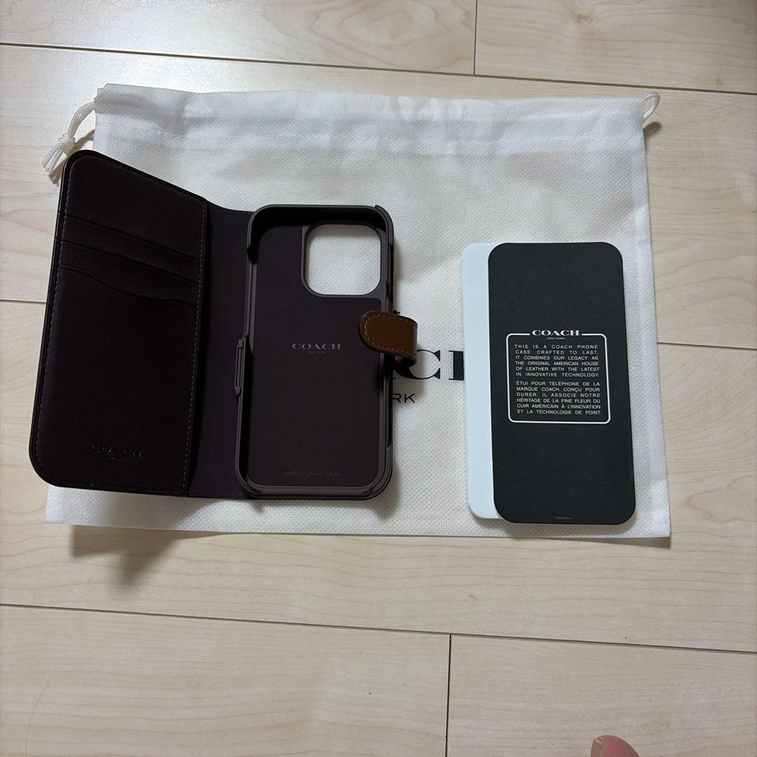 コーチiPhone15 PRO ケース シグネチャー 手帳型 スマホケース 収納