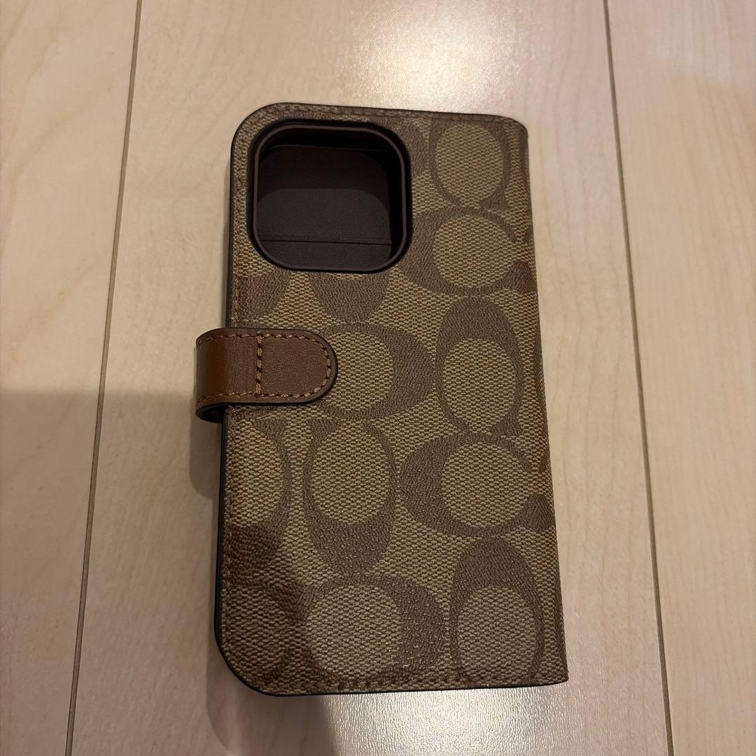 コーチiPhone15 PRO ケース シグネチャー 手帳型 スマホケース 収納