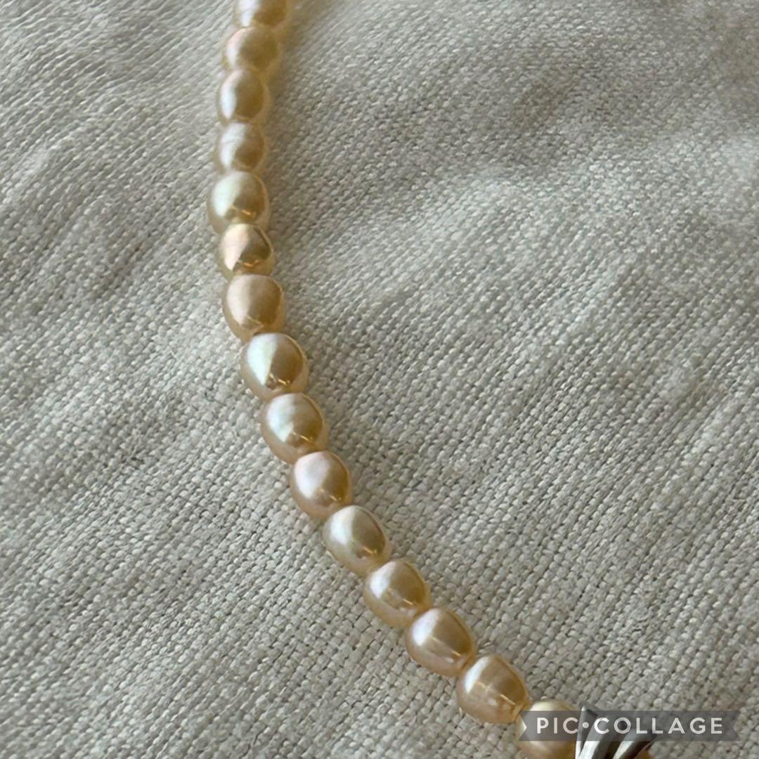 真珠ペンダント付きオレンジ色ライスパールネックレス