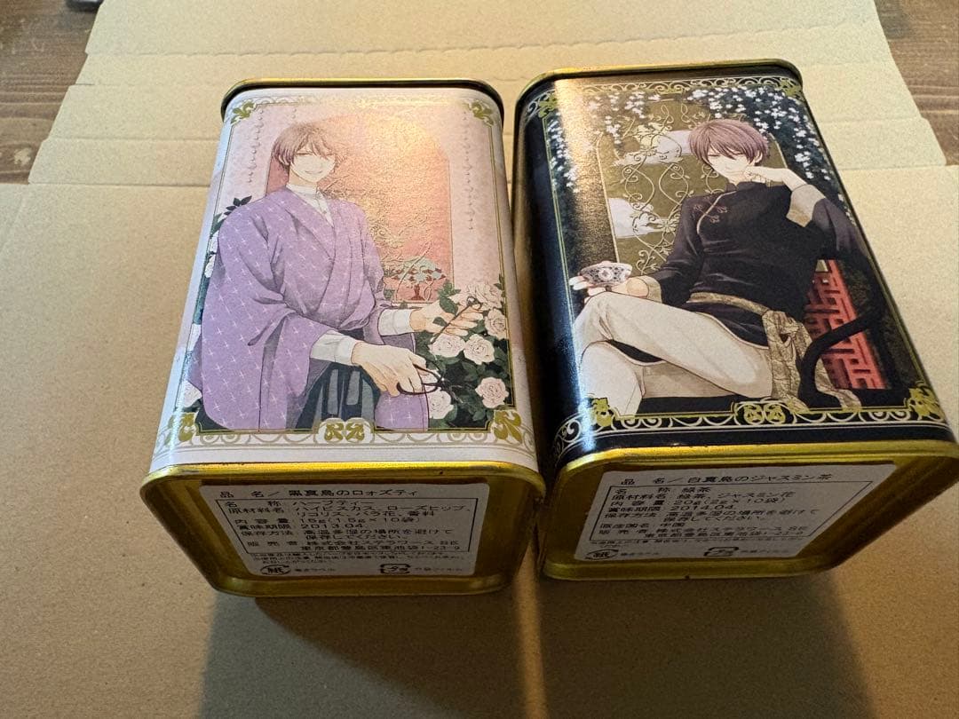 蝶の毒 華の鎖 真島の紅茶缶　白黒セット