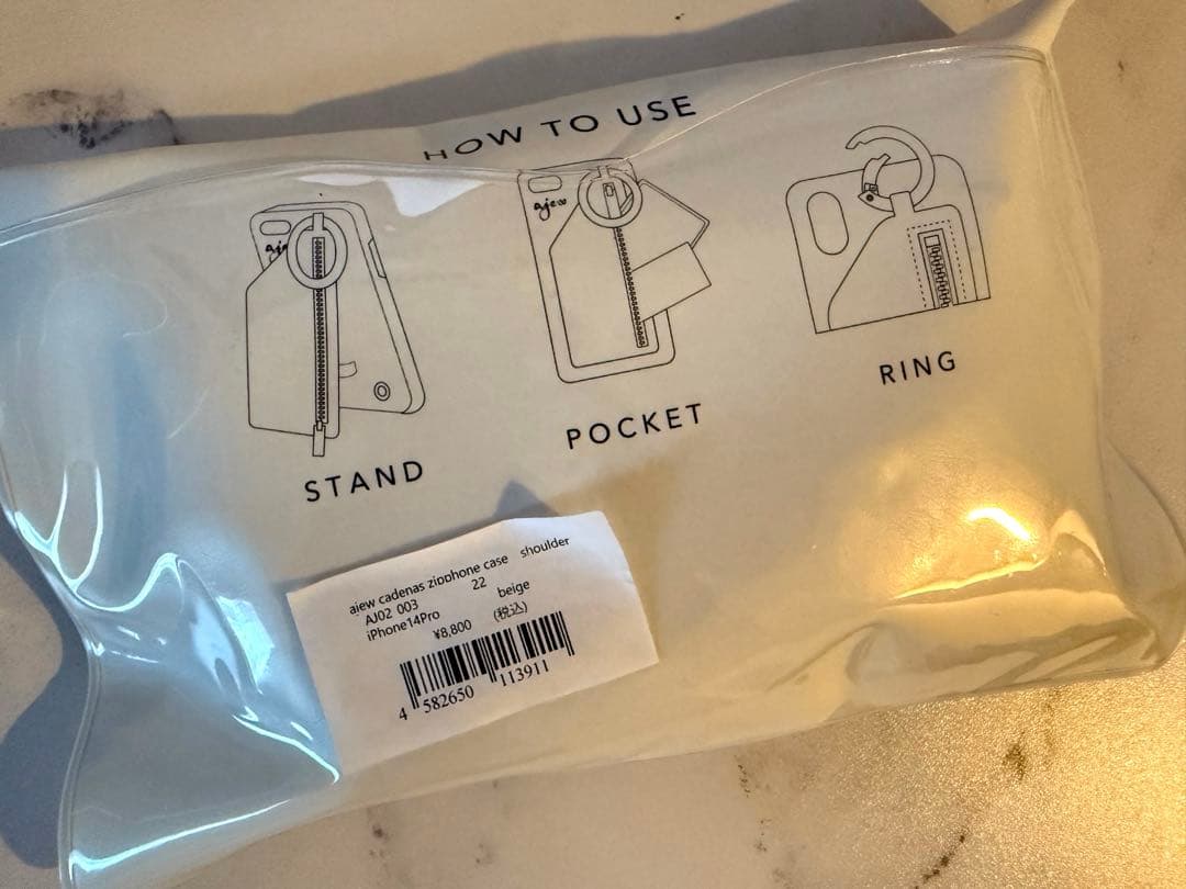 ajew エジューiPhone14Pro 紐付き　スマホケース　ベージュ正規品