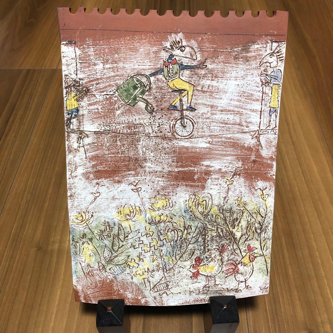 ユニークな一輪車の陶板