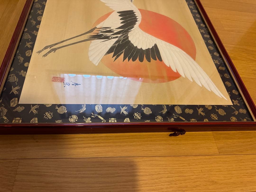 鶴が太陽に飛んでいる作品「飛翔」の木版画