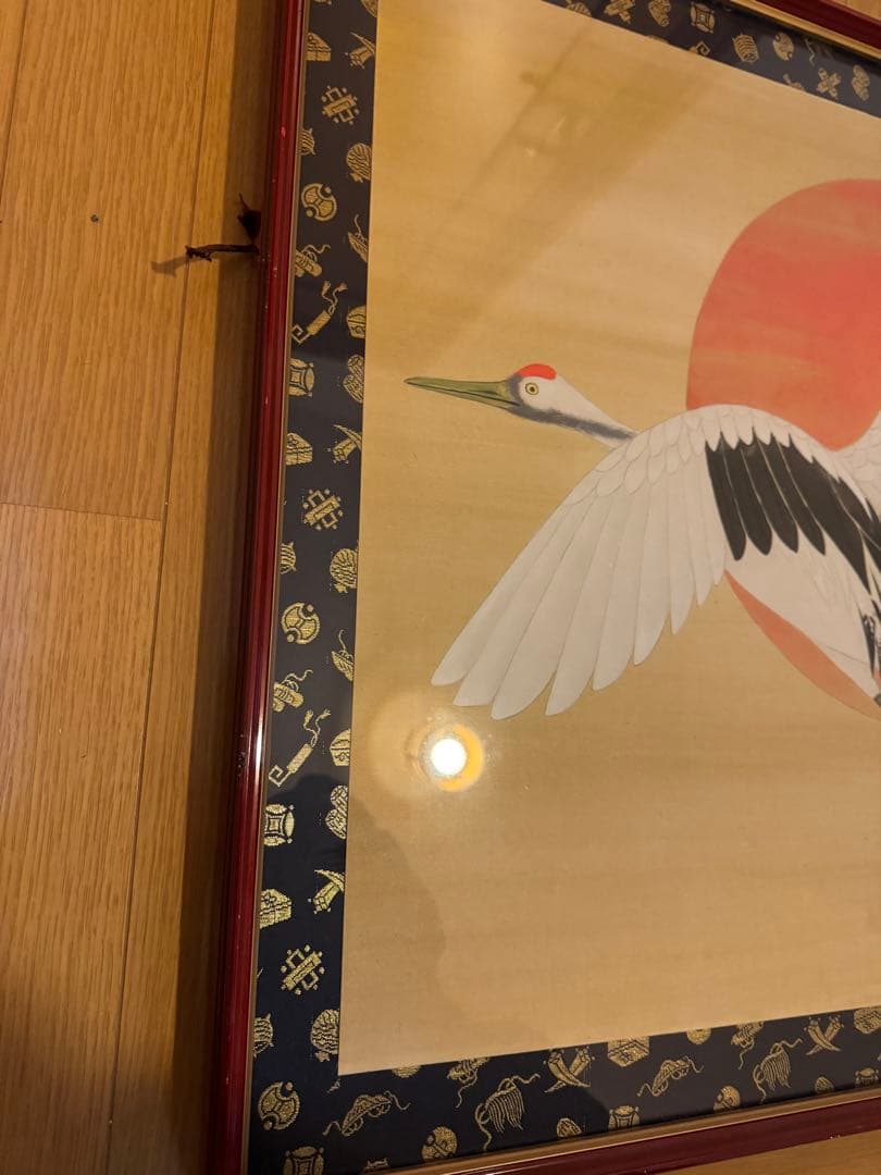 鶴が太陽に飛んでいる作品「飛翔」の木版画