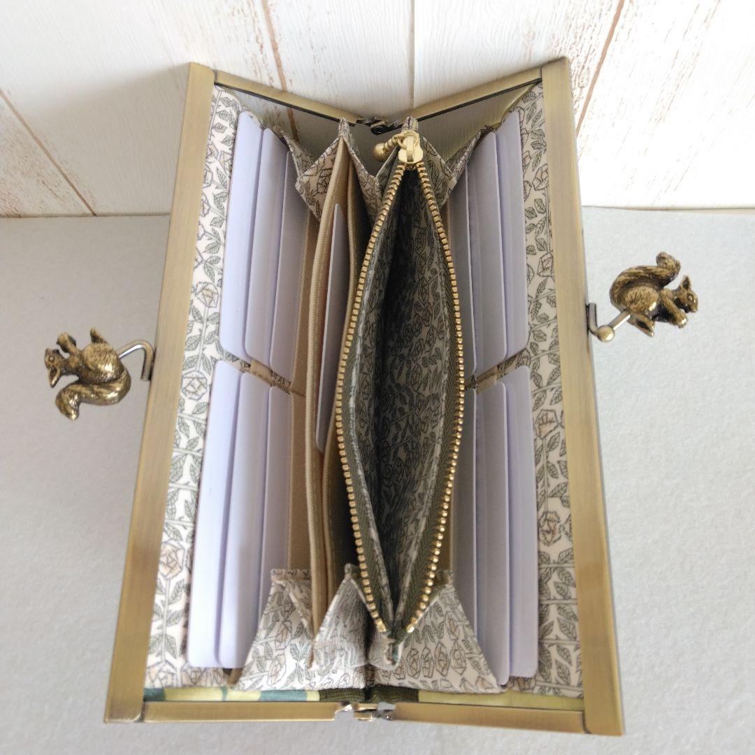 ミナペルホネン hanaco+choucho(カーキ) リス浮足がま口長財布