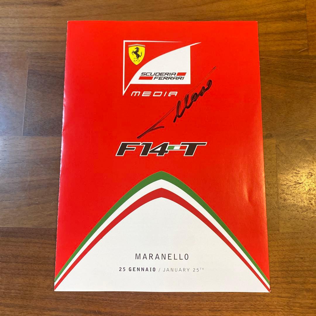 フェルナンド・アロンソ 直筆サイン入りフェラーリガイド ＆ 額装付きA4判写真