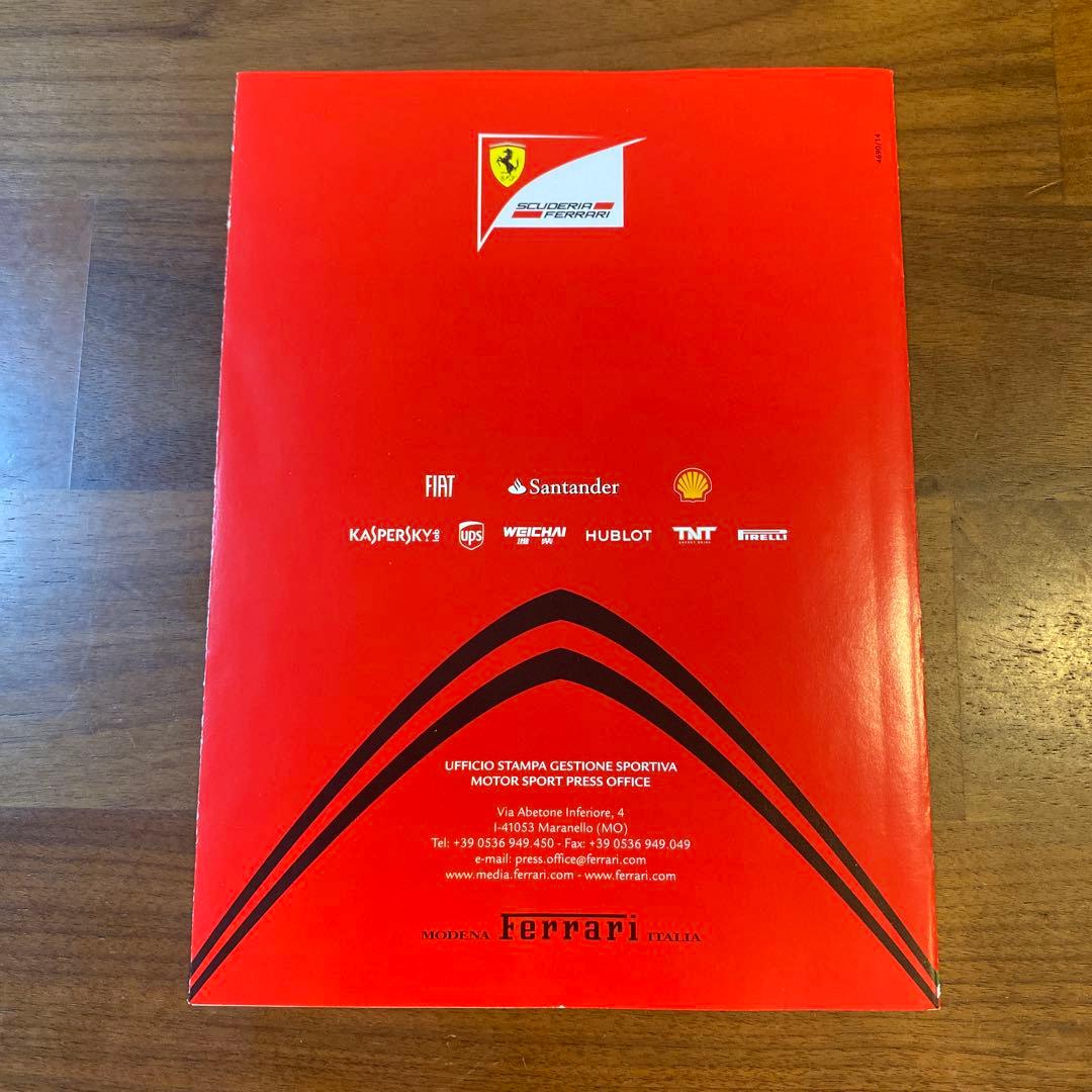 フェルナンド・アロンソ 直筆サイン入りフェラーリガイド ＆ 額装付きA4判写真