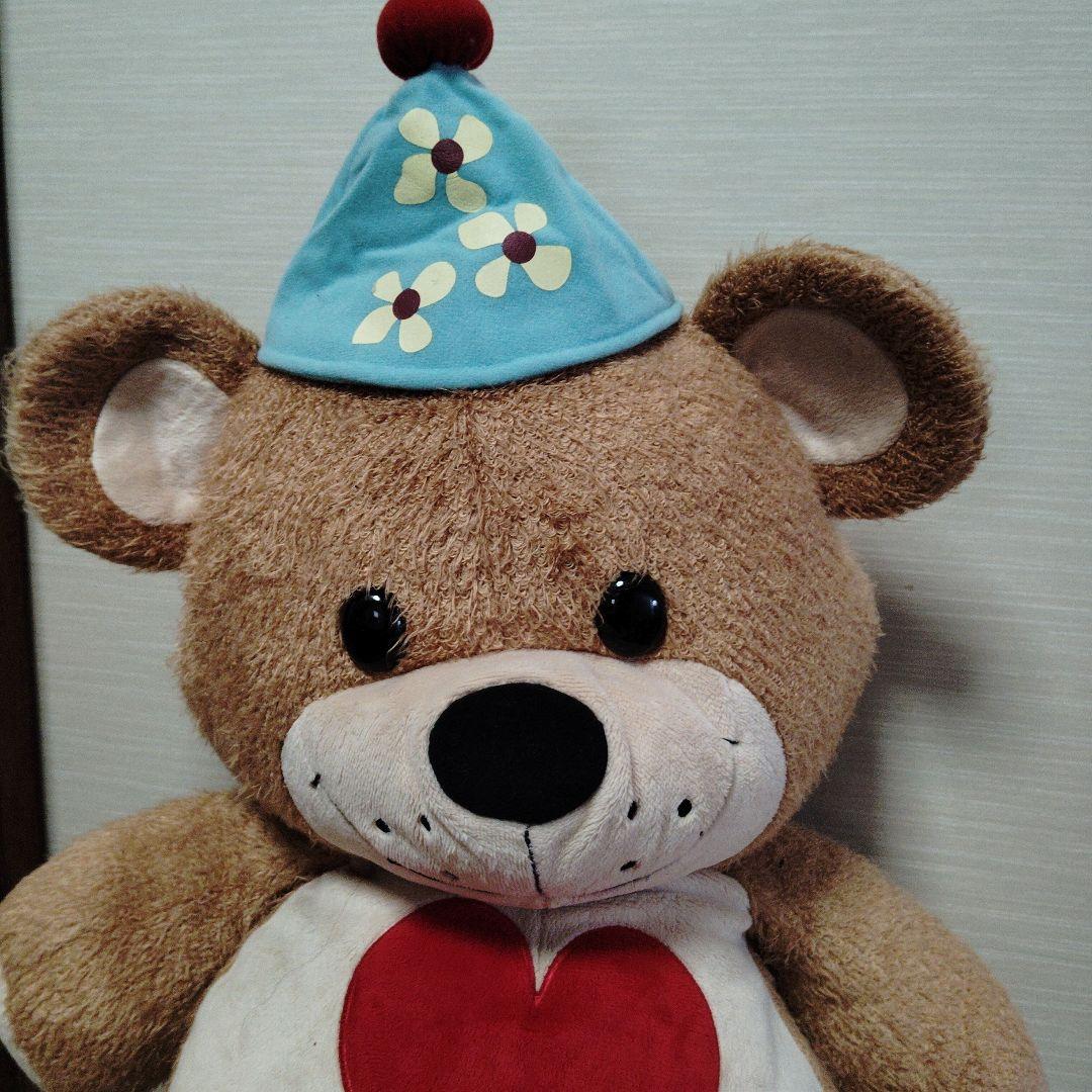 茶色いクマのぬいぐるみ 青い帽子付き