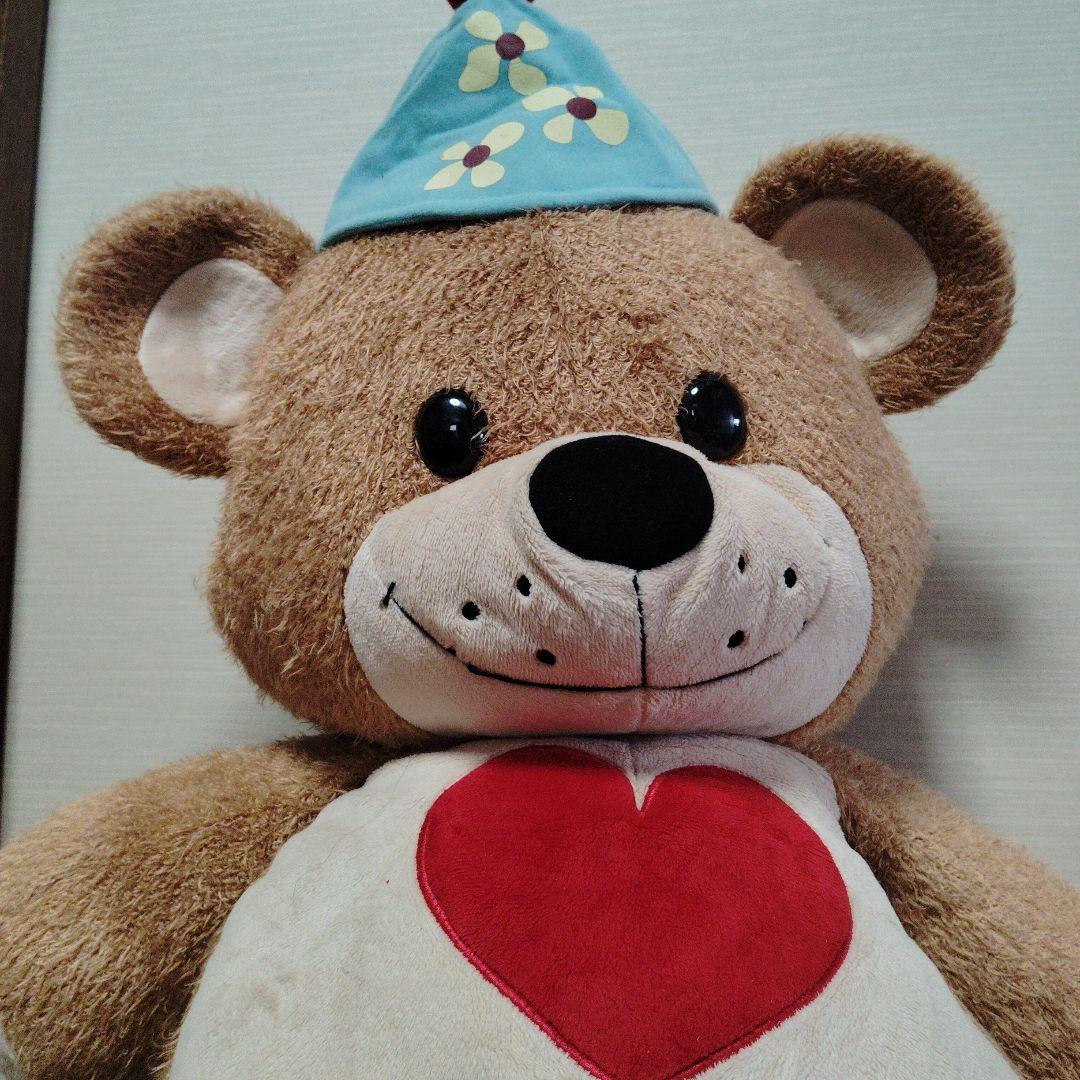 茶色いクマのぬいぐるみ 青い帽子付き