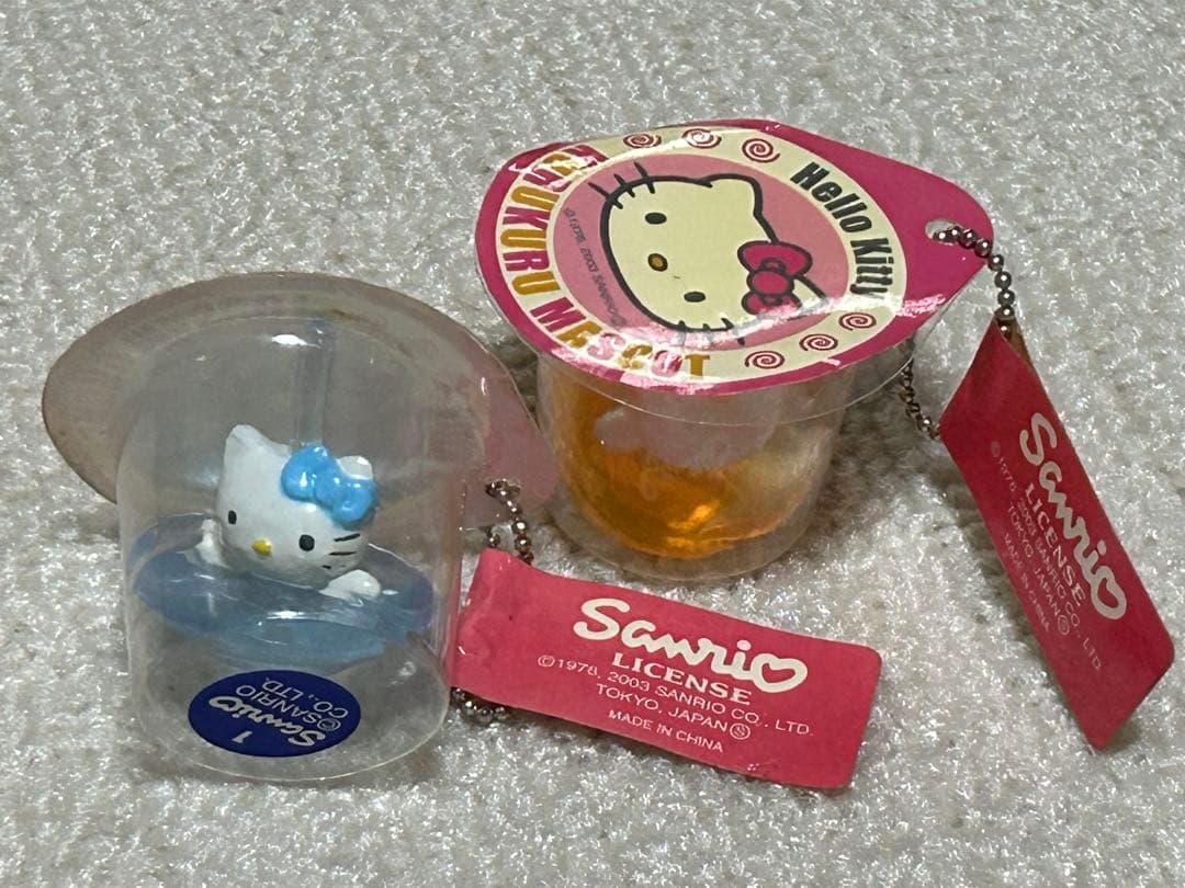 レア レトロキティアクセサリー小物雑貨 スケルトン駒コマ携帯おもちゃ 水色黄色