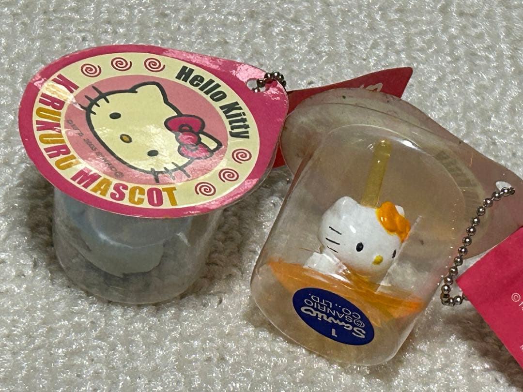 レア レトロキティアクセサリー小物雑貨 スケルトン駒コマ携帯おもちゃ 水色黄色