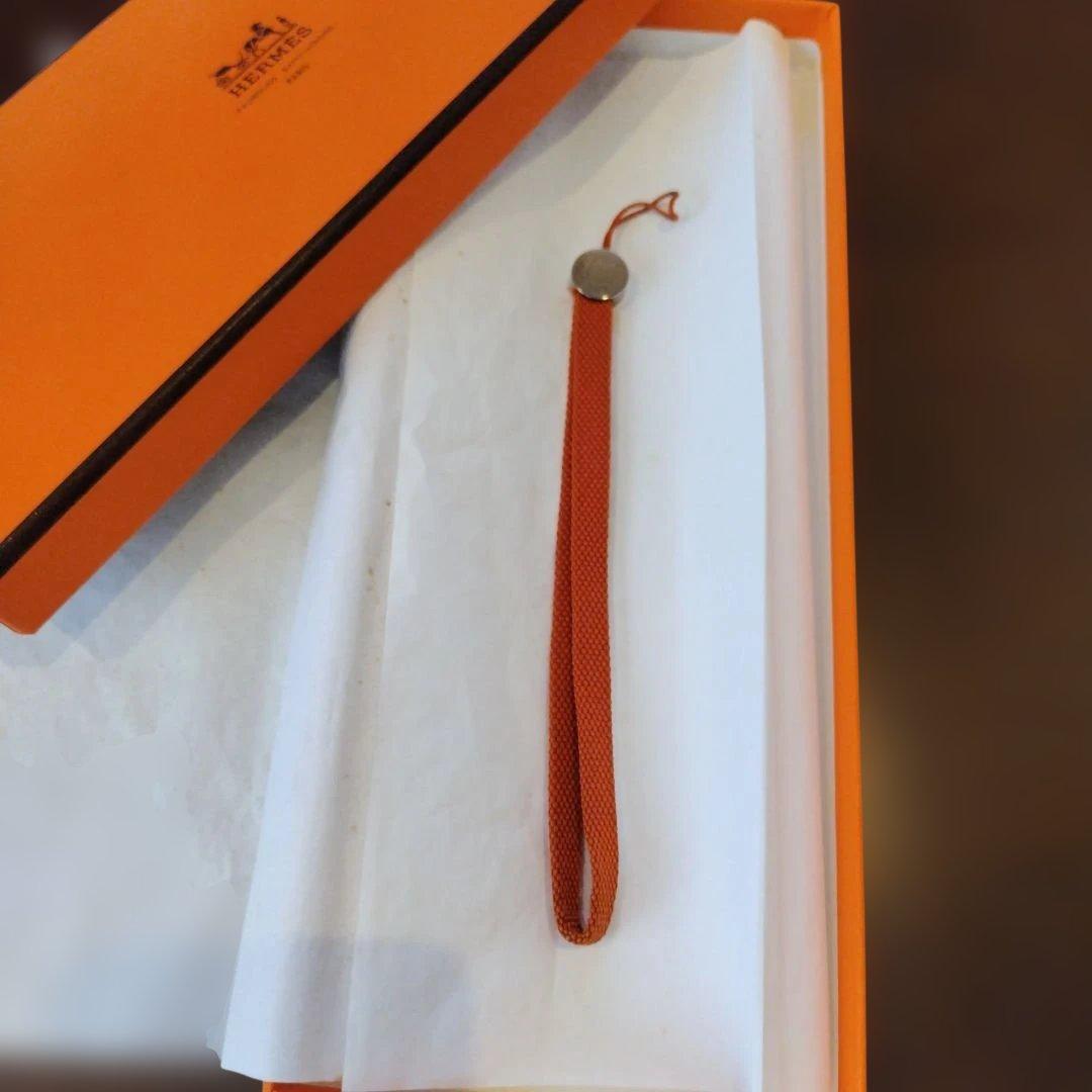 エルメス オレンジナイロンストラップ