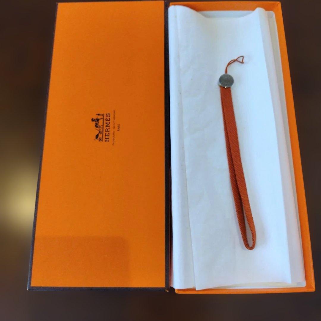 エルメス オレンジナイロンストラップ